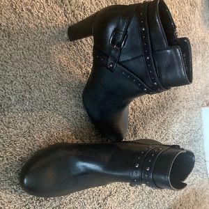 Black heeled booties with studs